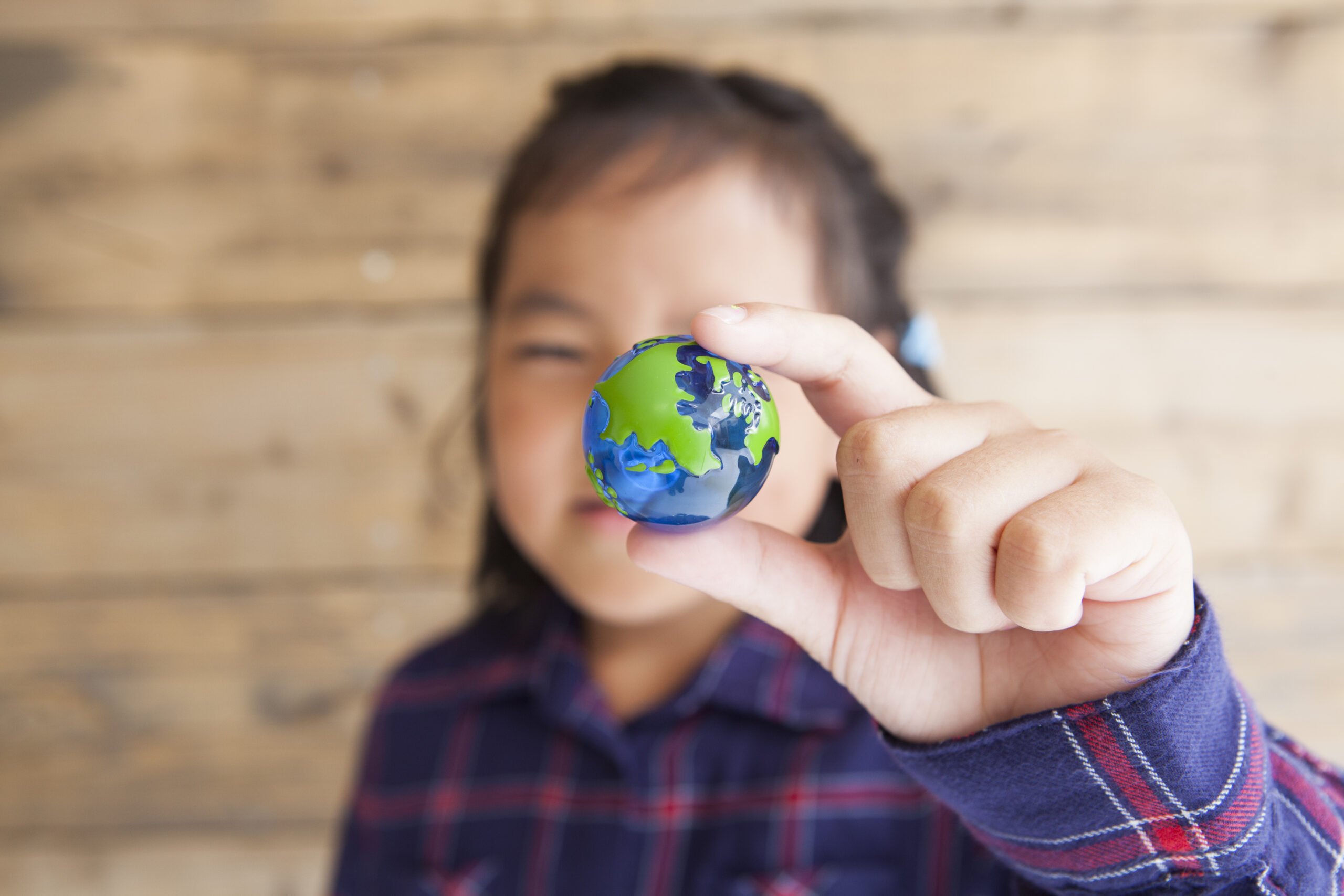 Image of child with small globe